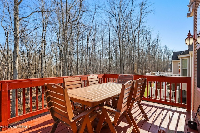 deck with outdoor dining space