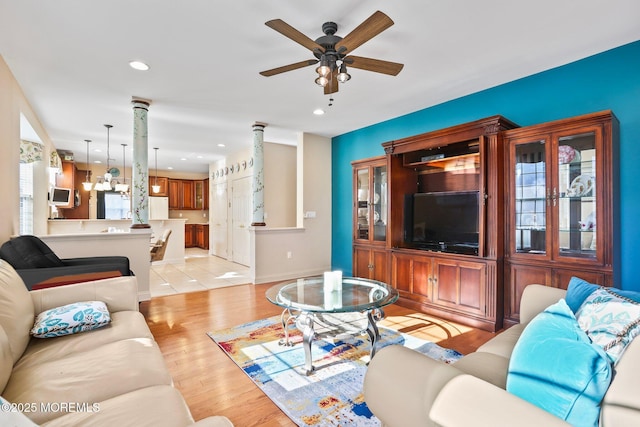 living area featuring recessed lighting, light wood-style flooring, baseboards, and a ceiling fan