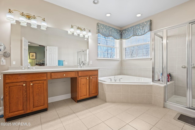 bathroom with tile patterned flooring, a shower stall, a bath, and double vanity