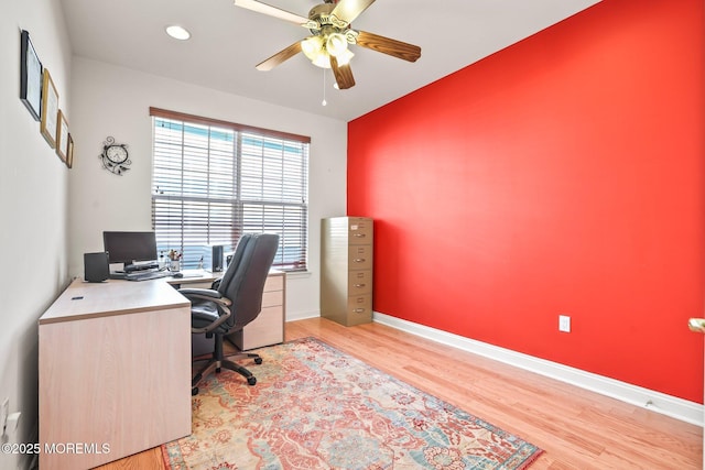 office space with recessed lighting, a ceiling fan, baseboards, and light wood finished floors