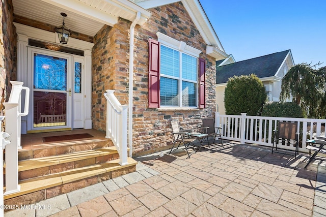 view of exterior entry with stone siding