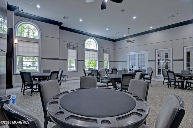 dining space featuring recessed lighting, baseboards, a high ceiling, and a ceiling fan