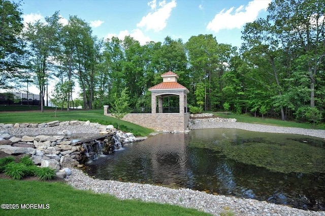 view of property's community featuring a gazebo and a lawn