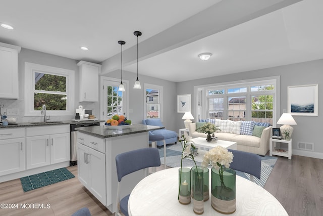 dining room with visible vents, recessed lighting, light wood-style flooring, and a healthy amount of sunlight