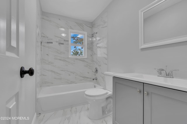 bathroom featuring marble finish floor, bathtub / shower combination, vanity, and toilet