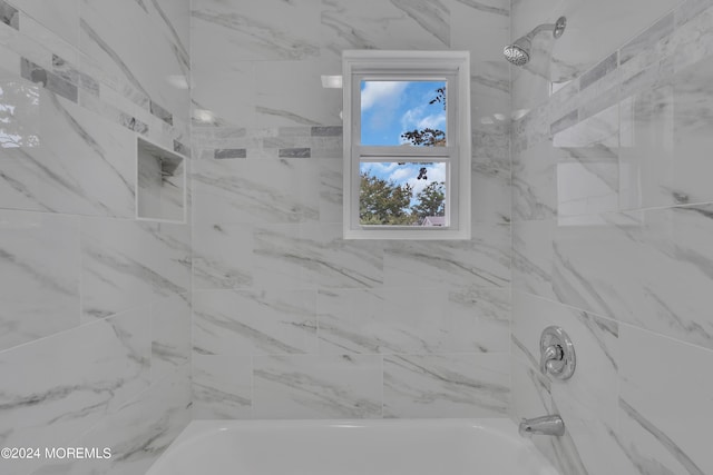 bathroom with bathing tub / shower combination