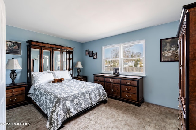 bedroom featuring light colored carpet