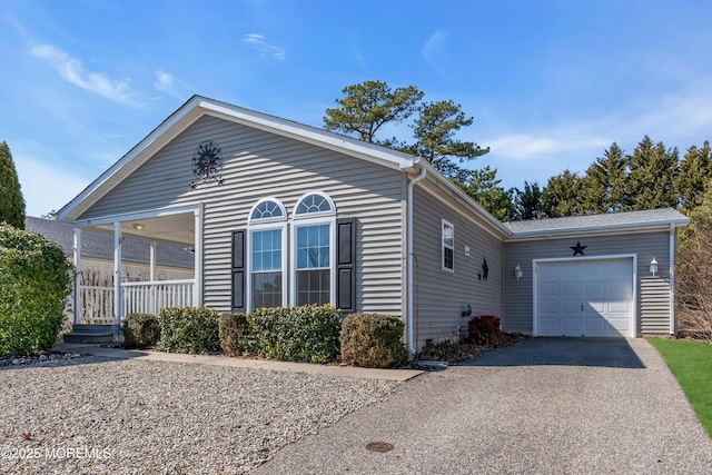 view of front of home featuring driveway and a garage