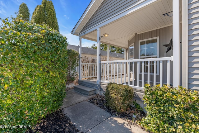 entrance to property featuring covered porch