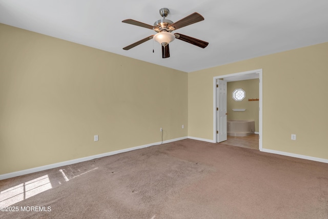 empty room with carpet flooring, baseboards, and ceiling fan