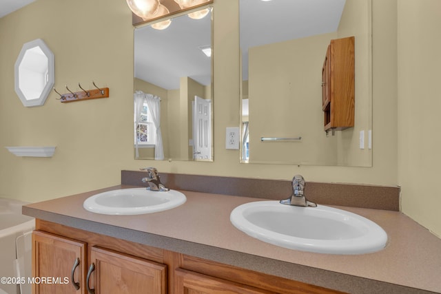 full bathroom featuring double vanity and a sink