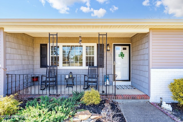 doorway to property with a porch