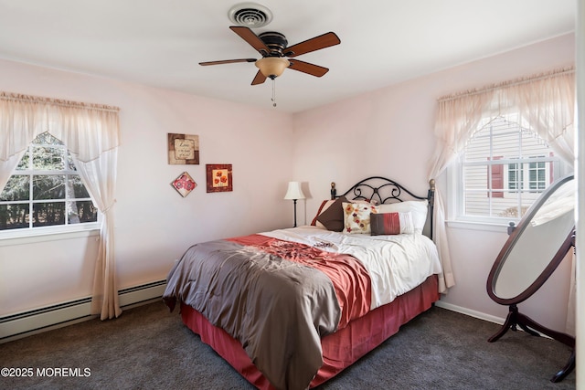 bedroom featuring baseboards, visible vents, ceiling fan, baseboard heating, and carpet floors