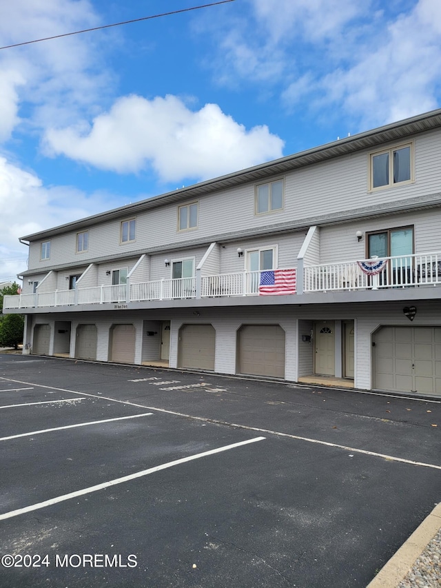 view of property featuring uncovered parking