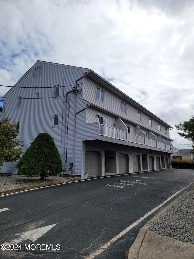 view of property with community garages