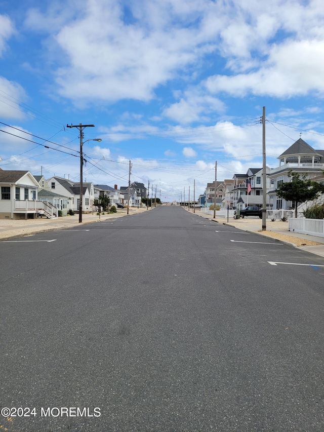 view of street featuring street lighting and a residential view