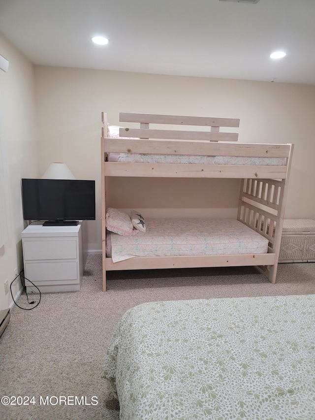 carpeted bedroom with recessed lighting