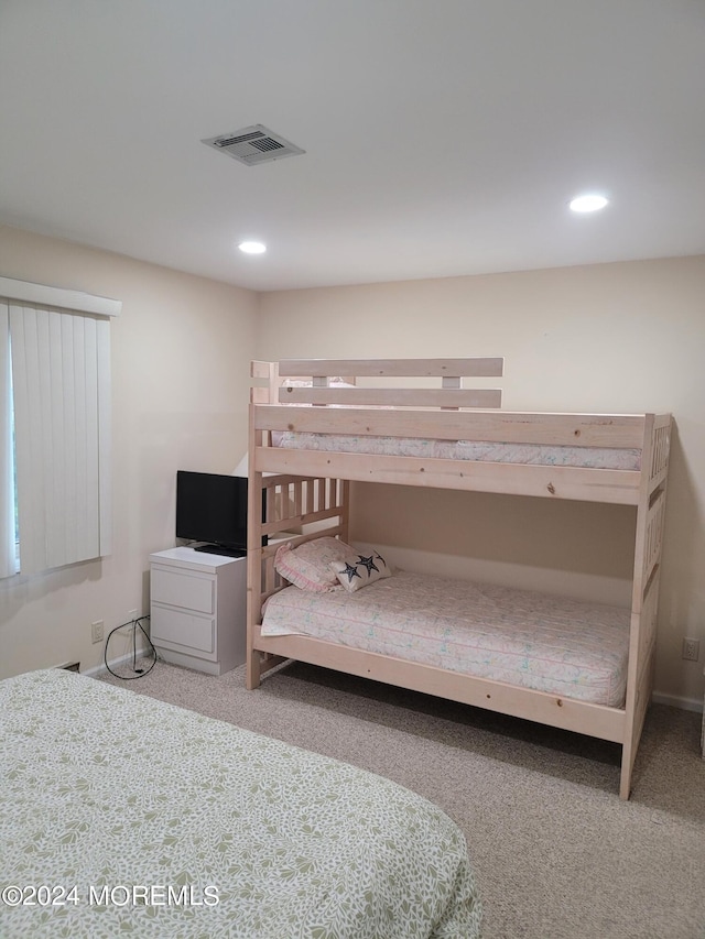 bedroom with carpet, visible vents, and recessed lighting