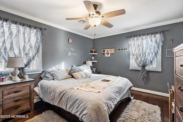 bedroom featuring visible vents, baseboards, multiple windows, dark wood-style floors, and crown molding