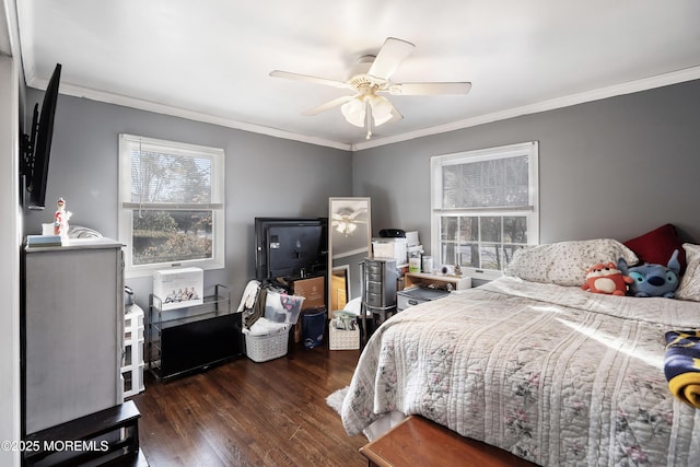 bedroom with crown molding, ceiling fan, and wood finished floors