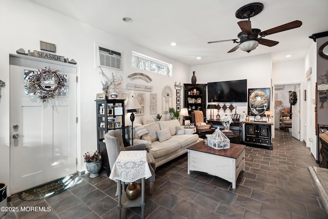 living room featuring ceiling fan, an AC wall unit, and recessed lighting