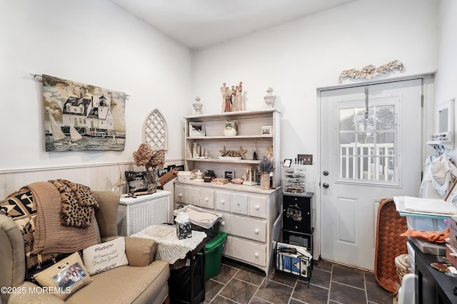 interior space featuring a wainscoted wall