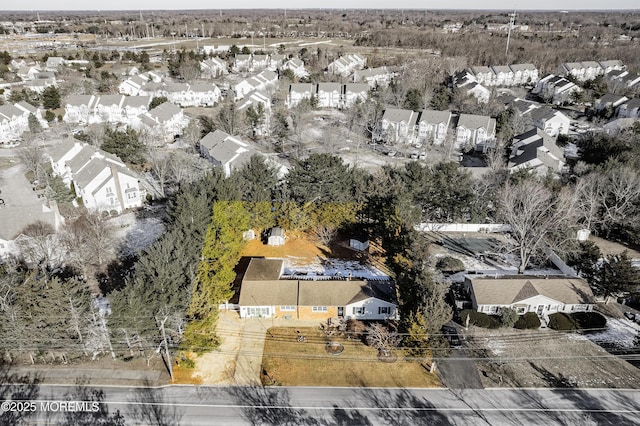 birds eye view of property with a residential view