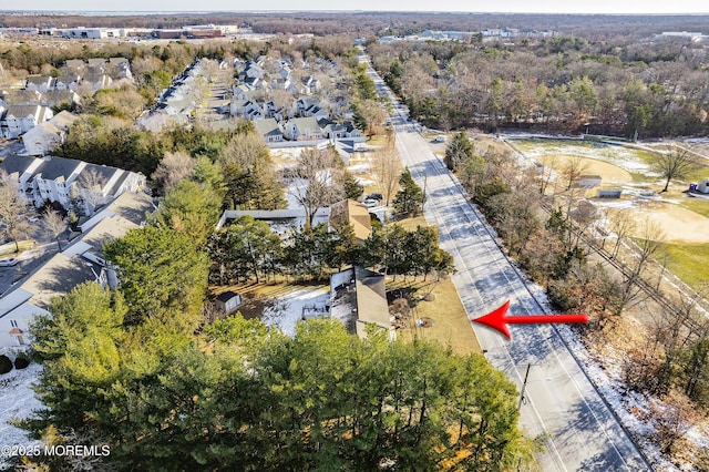 birds eye view of property with a residential view