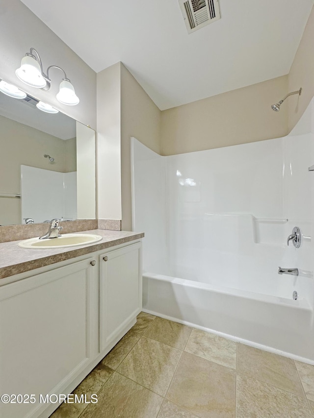 bathroom with shower / bath combination, tile patterned flooring, visible vents, and vanity