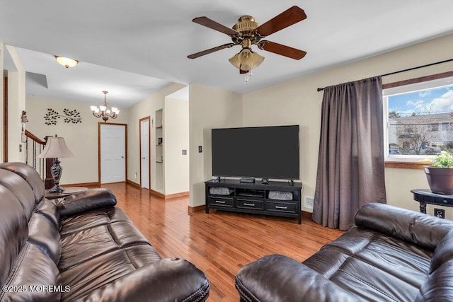 551 Chester Pkwy, Belford, NJ 07718 - living room with baseboards, wood finished floors, and ceiling fan with notable chandelier