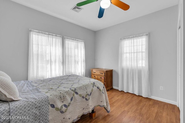 551 Chester Pkwy, Belford, NJ 07718 - bedroom with visible vents, baseboards, wood finished floors, and a ceiling fan