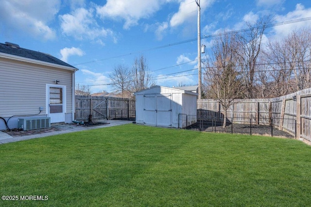 551 Chester Pkwy, Belford, NJ 07718 - view of yard featuring an outbuilding, central air condition unit, a storage shed, and a fenced backyard