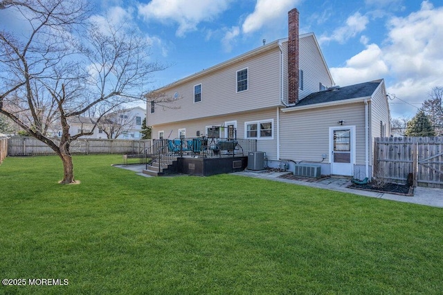551 Chester Pkwy, Belford, NJ 07718 - back of house with a wooden deck, a lawn, central AC, and a fenced backyard
