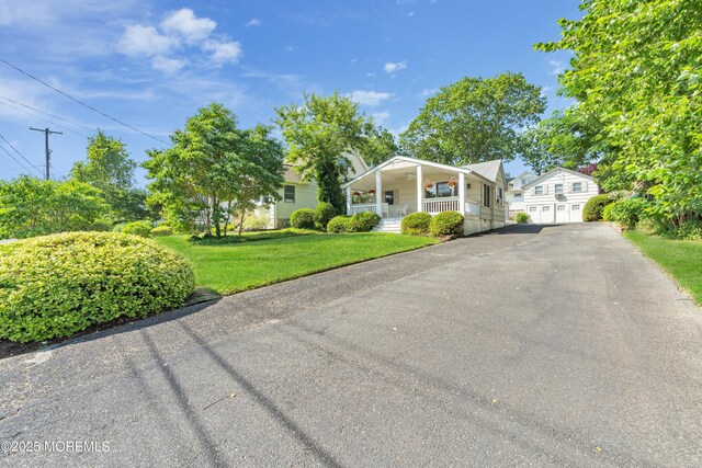 view of front of home featuring a porch and a front yard