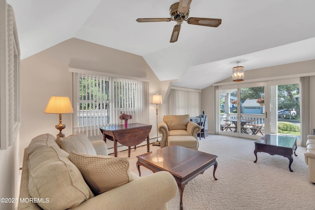 carpeted living room featuring vaulted ceiling, a baseboard heating unit, and ceiling fan with notable chandelier