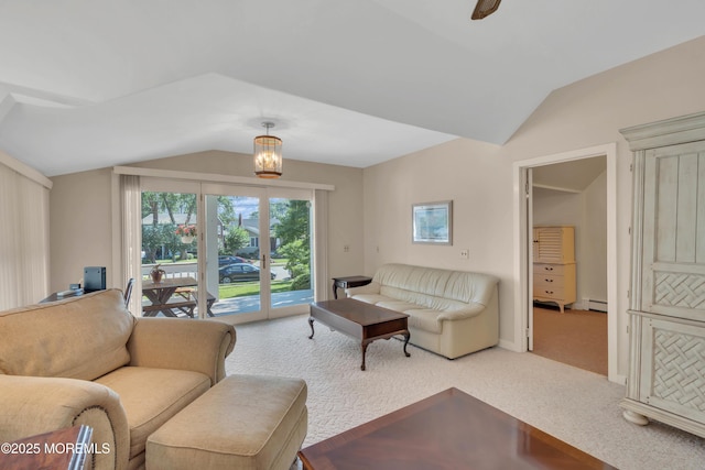 carpeted living area featuring a baseboard heating unit and vaulted ceiling