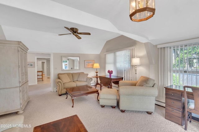 living area with a baseboard radiator, light carpet, vaulted ceiling, and ceiling fan with notable chandelier