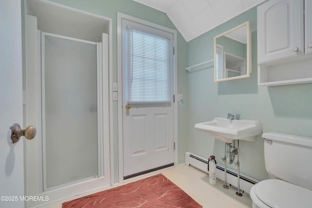 bathroom with baseboard heating, toilet, a sink, vaulted ceiling, and a shower stall