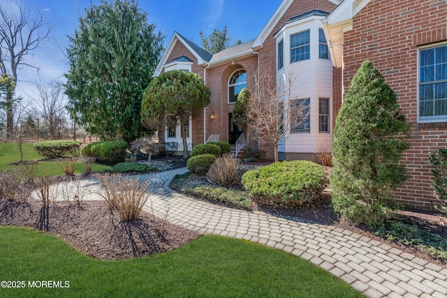 view of front of property featuring brick siding