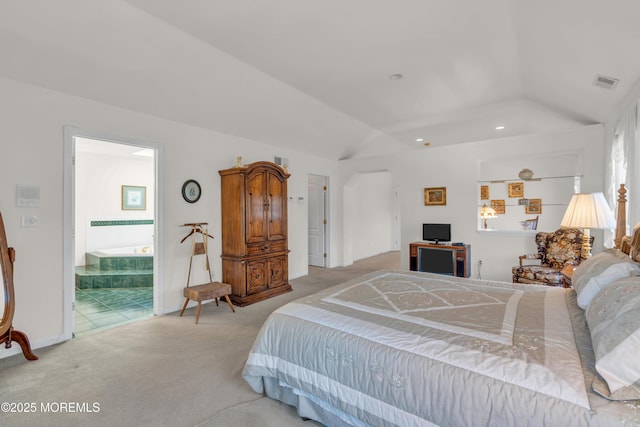 bedroom featuring visible vents, lofted ceiling, recessed lighting, light carpet, and connected bathroom