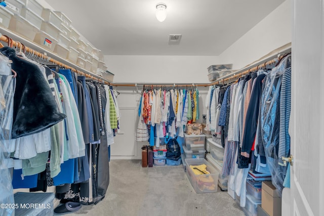 spacious closet featuring visible vents