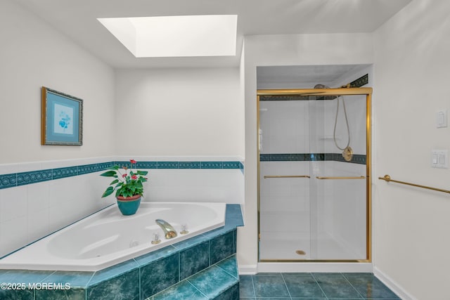 full bathroom featuring a shower stall, a skylight, a bath, and tile patterned floors