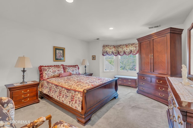 bedroom with recessed lighting, visible vents, and light carpet