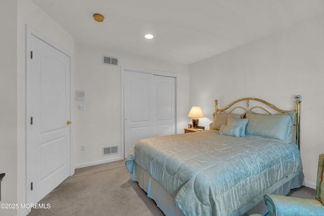 carpeted bedroom with recessed lighting, baseboards, visible vents, and a closet