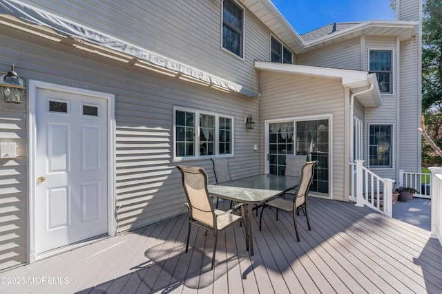 wooden deck featuring outdoor dining space