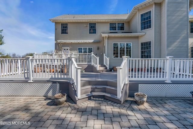 back of house with a patio and a deck