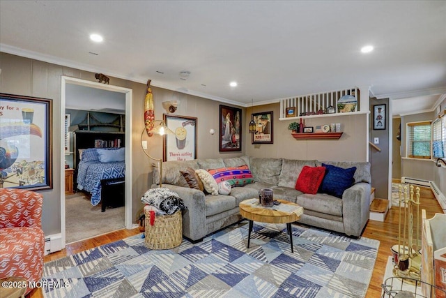 living room with a baseboard radiator, ornamental molding, and wood finished floors