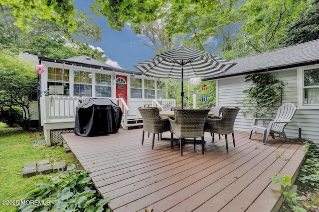 deck featuring area for grilling and outdoor dining space