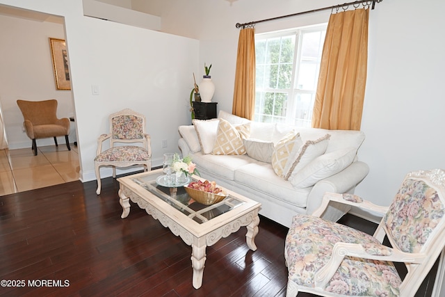 living area with wood finished floors and baseboards