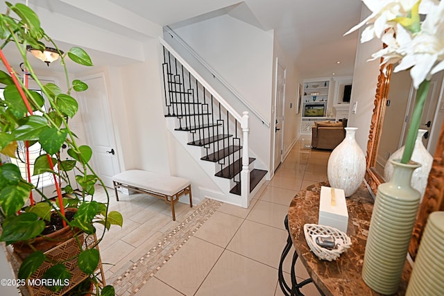 staircase featuring tile patterned floors